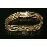 An Edwardian four row gold gate bracelet