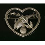 A sterling silver heart shaped dolphin brooch by Georg Jensen designed by Arno Molinowski