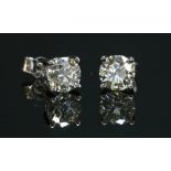 A pair of 18ct white gold single stone diamond stud earrings,