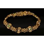An Edwardian gold, peridot and split pearl, four row gate bracelet,