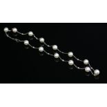 An 18ct white gold cultured pearl and diamond necklace