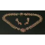A Georgian cased gold flat cut foiled garnet necklace and earring suite,