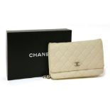 A Chanel cream caviar leather flap evening handbag