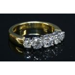 An 18ct gold graduated five stone diamond ring