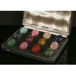 A cased set of twelve carved specimen hardstone eggs