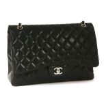 A Chanel classic single flap black leather maxi handbag