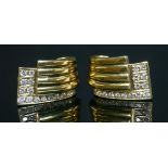 A pair of 18ct gold diamond set earrings, by David Morris,