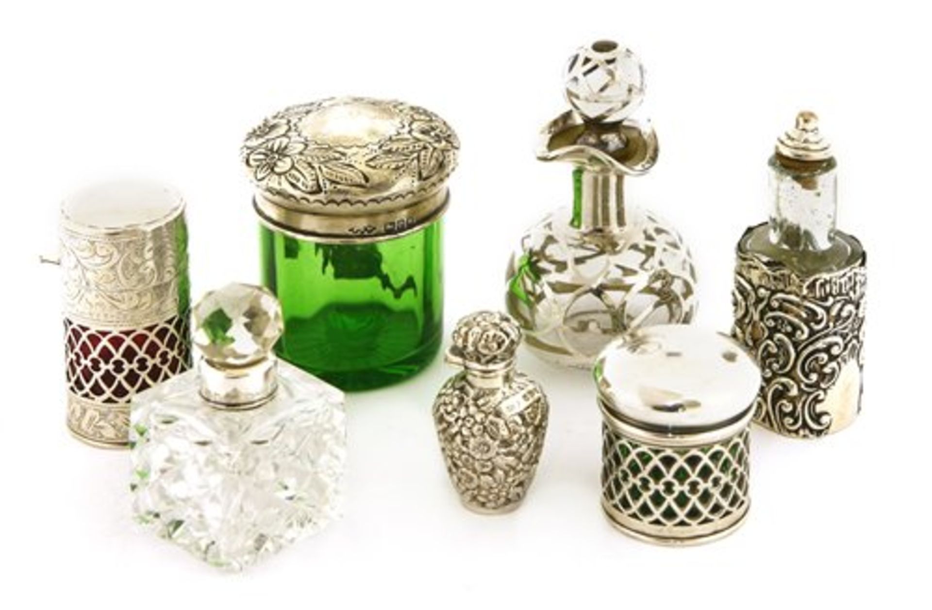 Seven assorted silver and glass scent bottles and dressing table pot,