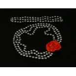 A French three row cultured pearl and coral necklace and bracelet suite,