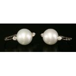 A pair of Continental white gold cultured South Sea pearl and diamond earrings