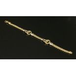 An 18ct two colour gold hollow curb link bracelet