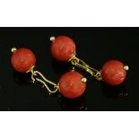 A pair of French gold and coral cufflinks