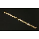 An 18ct gold two row Panther link bracelet