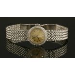 A ladies' 18ct white gold diamond set Omega 'Ladymatic' mechanical bracelet watch