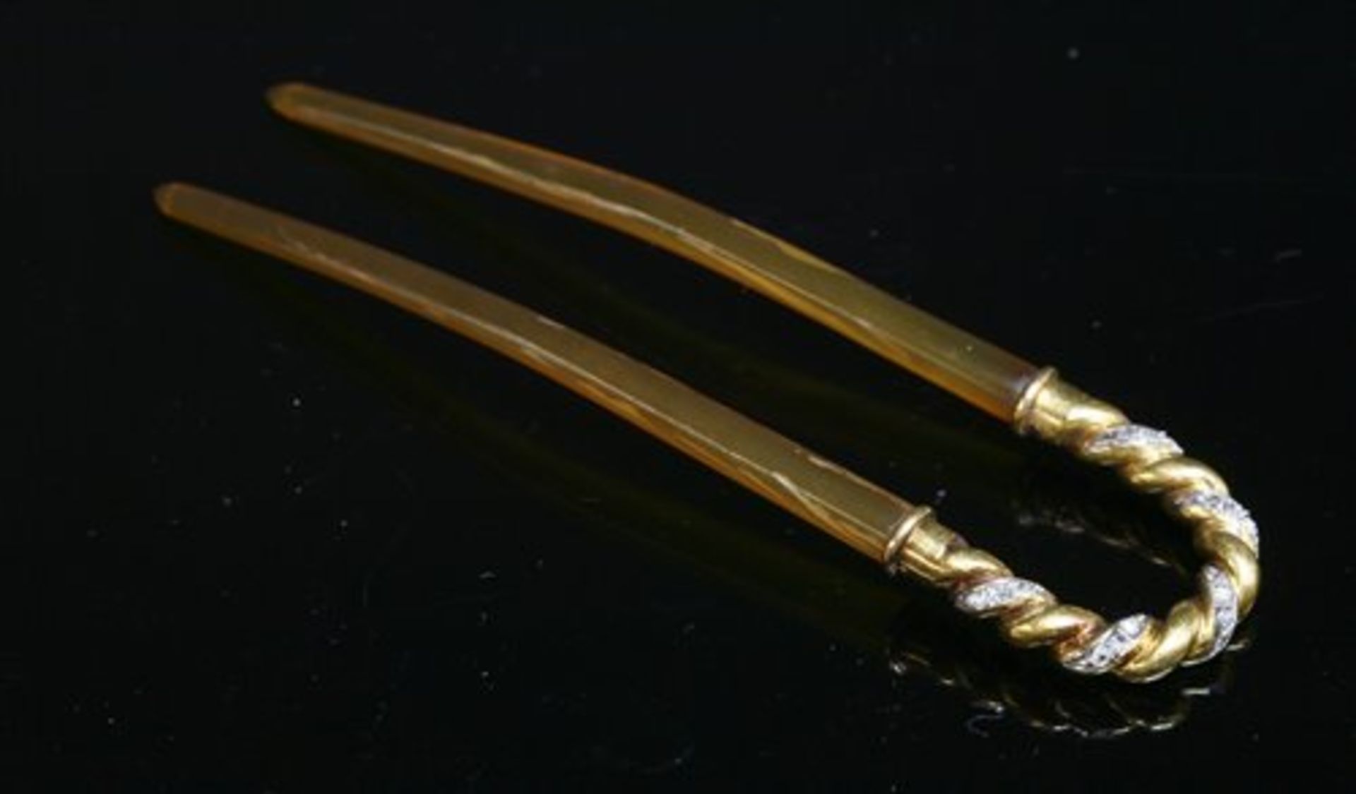 An Edwardian gold and diamond set hairpin or fourchere