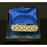 A cased Victorian and split pearl bangle,