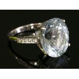 An 18ct white gold single stone aquamarine ring