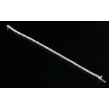 An 18ct white gold diamond set line bracelet,