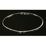 A white gold diamond set collar