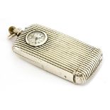 A sterling silver travelling clock vesta case