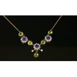 An Edwardian style silver gilt and gold, amethyst, peridot, cultured pearl and diamond necklace