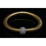 A Continental two colour gold diamond set gas pipe or tubogas bracelet,