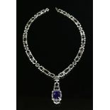 A white gold tanzanite and diamond Art Deco style necklace with interchangeable pendant drop