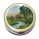 A silver and enamel circular compact,