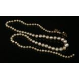 A single row graduated natural pearl necklace