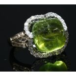 A white gold peridot and diamond quatrefoil cocktail ring,