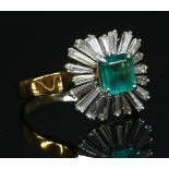 An American emerald and diamond cushion shaped cluster ring,
