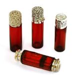 Four silver and cranberry glass scent bottles,