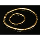 A yellow and rose gold necklace and bracelet suite, by Tannler,