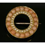 A late Victorian gold, coral and split pearl circle brooch, c.1900,