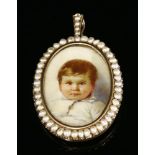 An Edwardian gold and split pearl set painted miniature portrait of a young child, c.1910,