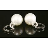 A pair of Continental white gold cultured South Sea pearl and diamond drop earrings