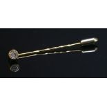 A single stone diamond stick pin,