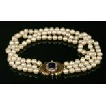 A three row uniform cultured pearl necklace