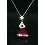 An 18ct yellow and white gold rhodolite and diamond pendant,