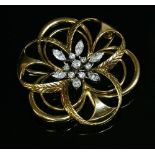 A two colour gold diamond set brooch/pendant,