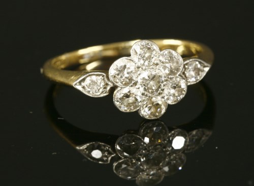 A diamond set daisy cluster ring