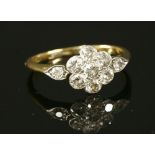 A diamond set daisy cluster ring