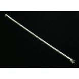 An 18ct white gold diamond set line bracelet,