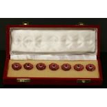 A cased set of gold diamond set buttons,