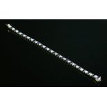 A platinum sapphire and diamond line bracelet,