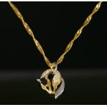 A gold sapphire and diamond set fox pendant,