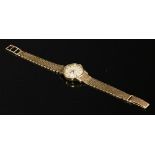 A ladies' 9ct gold Omega automatic strap watch