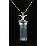 An 18ct white gold aquamarine and diamond pendant