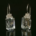 A pair of Continental white gold aquamarine and diamond drop earrings