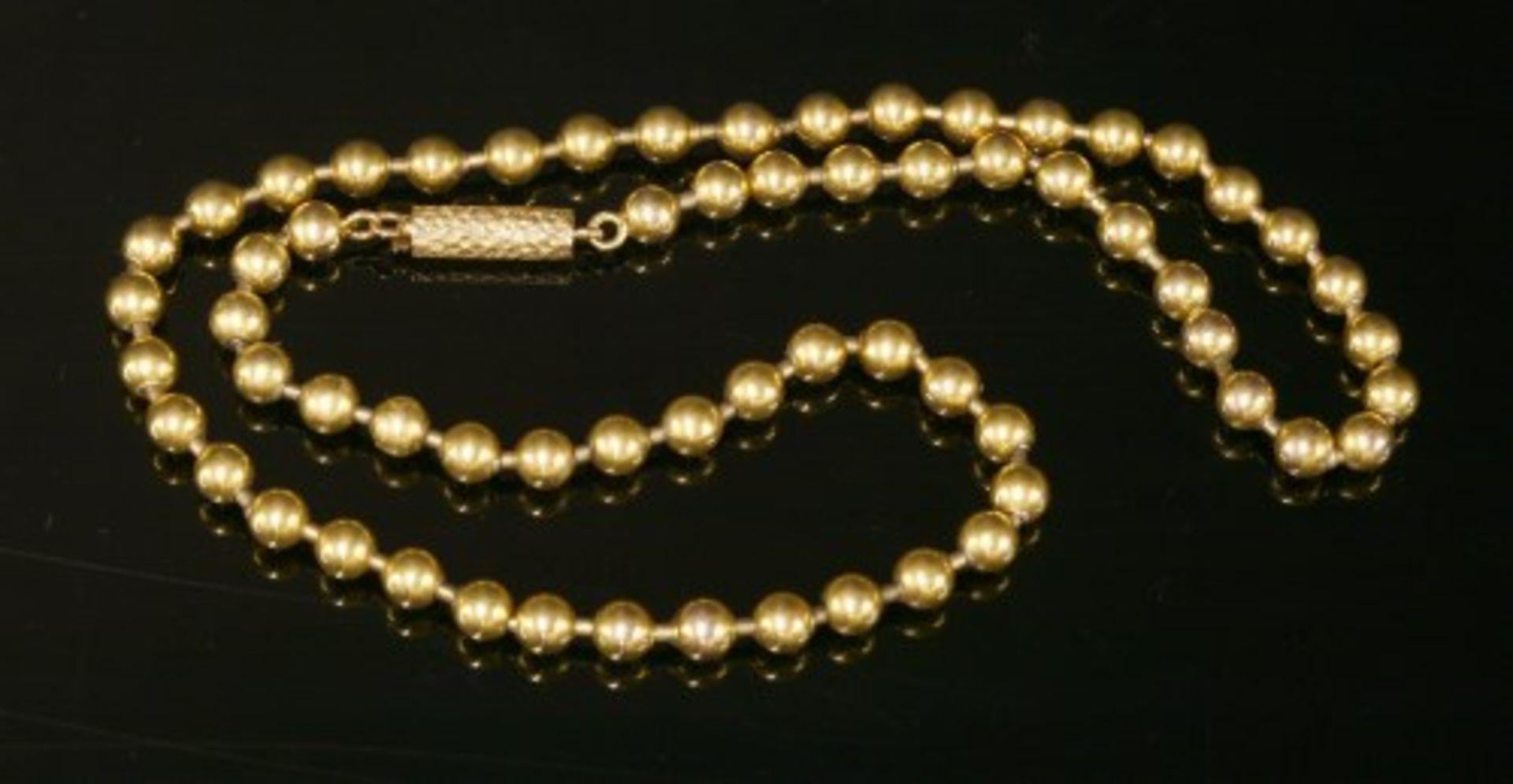 A cased Victorian gold bead necklace